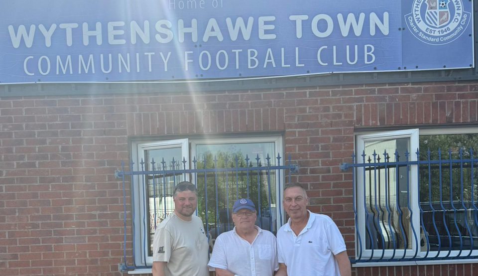 Club officials outside the Wythenshawe Town clubhouse